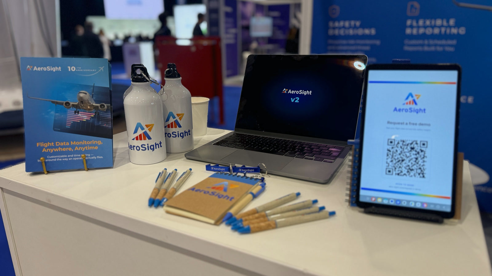 AeroSight FDM v2 on a laptop beside a tablet with the demo QR code at booth 2-139